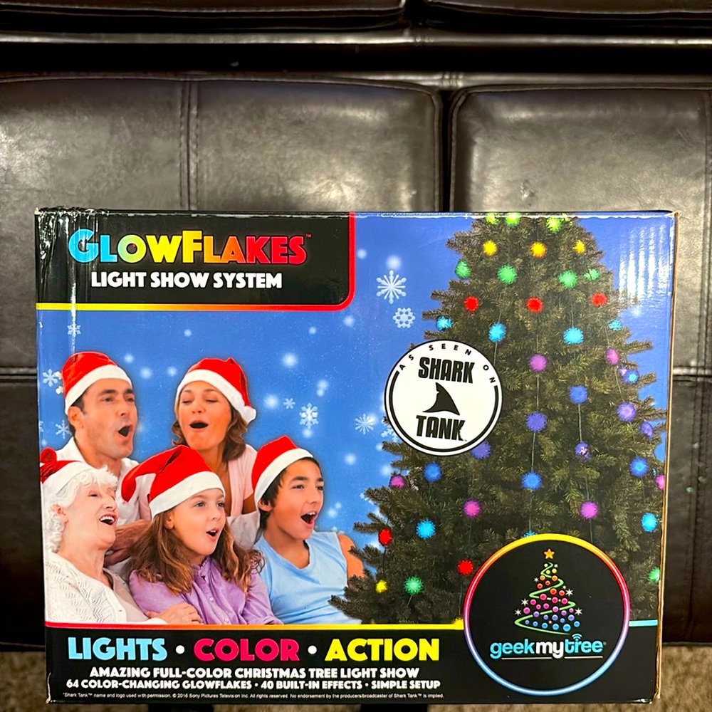 Never opened, GlowFlakes light show system to put on Christmas tree.